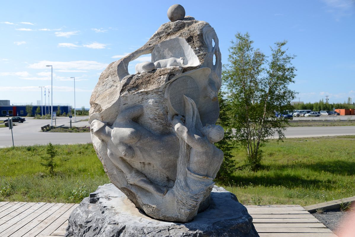 08E Sculpture Has Animals and Symbols For Inuit and Gwichin Culture Outside The Western Arctic Regional Visitor Centre In Inuvik Northwest Territories